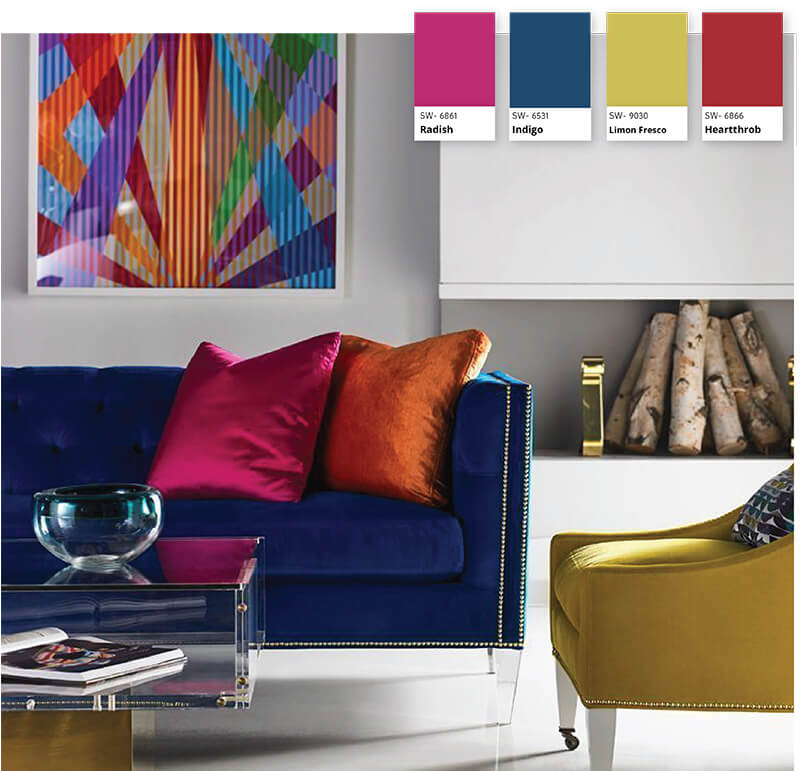 A purple and green sofa in a room decorated with orange accents to create a triadic color scheme